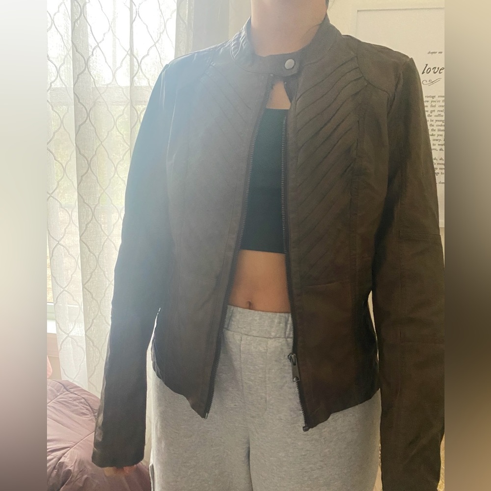 maurice’s brown leather jacket